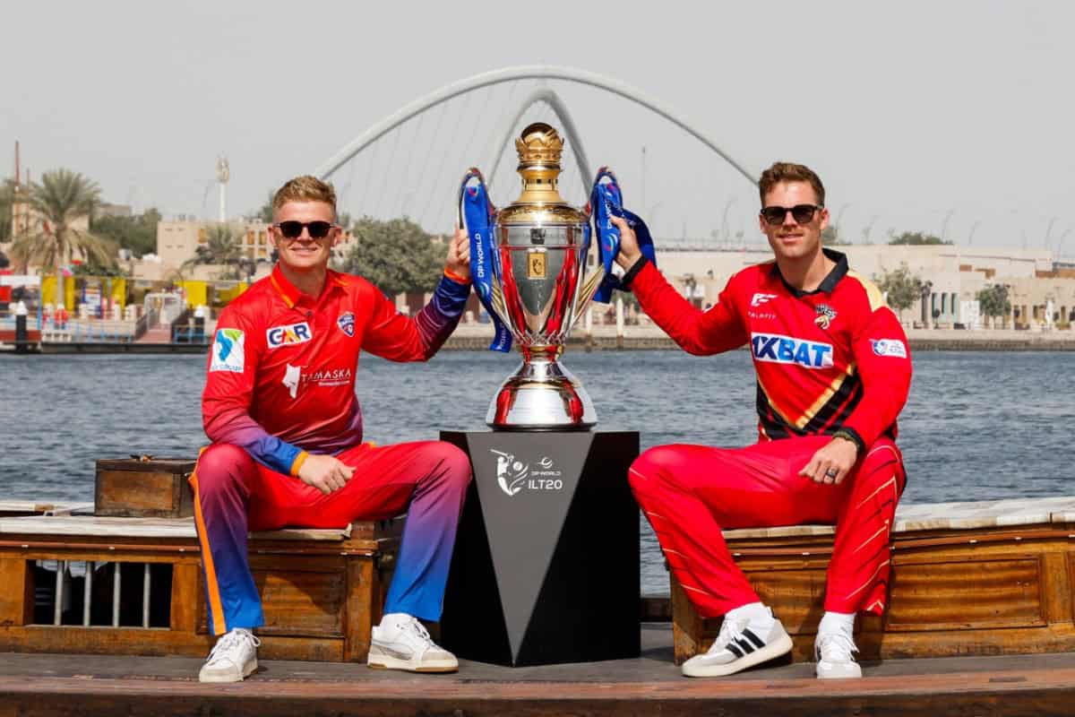 Sam Billings and Lockie ferguson pose with the ILT20 trophy ahead of Final